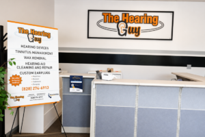 Hearing care professional evaluating a hearing aid fit in the office